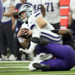 
              TCU defensive lineman Dylan Horton (98) sacks Kansas State quarterback Will Howard (18) in the first half of the Big 12 Conference championship NCAA college football game, Saturday, Dec. 3, 2022, in Arlington, Texas. (AP Photo/LM Otero)
            