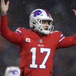 
              Buffalo Bills quarterback Josh Allen (17) celebrates after diving for a two-point conversion during the second half of an NFL football game against the Miami Dolphins in Orchard Park, N.Y., Saturday, Dec. 17, 2022. (AP Photo/Joshua Bessex)
            