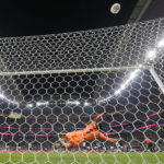 
              England's Harry Kane blasts a penalty over the bar to miss as France's goalkeeper Hugo Lloris dives during the World Cup quarterfinal soccer match between England and France, at the Al Bayt Stadium in Al Khor, Qatar, Saturday, Dec. 10, 2022. (AP Photo/Frank Augstein)
            