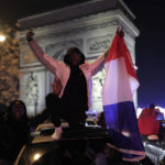
              France supporters celebrate France's victory with French flags at the Arc de Triomphe after the World Cup semifinal soccer match between France and Morocco, Wednesday, Dec. 14, 2022 in Paris. France defeated Morocco 2-0 and will head into Sunday's title match against Argentina. (AP Photo/Lewis Joly)
            
