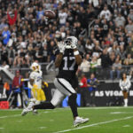 
              Las Vegas Raiders wide receiver Davante Adams (17) pulls in a touchdown reception during the second half of an NFL football game against the Los Angeles Chargers, Sunday, Dec. 4, 2022, in Las Vegas. (AP Photo/David Becker)
            