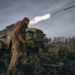 
              Ukrainian military's Grad multiple rocket launcher fires rockets at Russian positions in the frontline near Bakhmut, Donetsk region, Ukraine, Thursday, Nov. 24, 2022. (AP Photo/LIBKOS)
            
