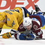 
              Nashville Predators right wing Nino Niederreiter (22) collides with Colorado Avalanche right wing Mikko Rantanen (96) during the third period of an NHL hockey game Friday, Dec. 23, 2022, in Nashville, Tenn. The Avalanche won in overtime 3-2. (AP Photo/Mark Zaleski)
            
