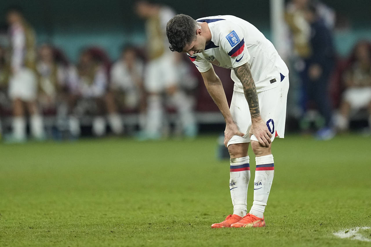 Christian Pulisic of the United States is dejected after the World Cup round of 16 soccer match bet...