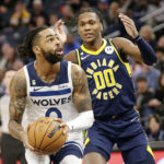 
              Minnesota Timberwolves guard D'Angelo Russell (0) shoots on Indiana Pacers guard Bennedict Mathurin (00) in the second quarter of an NBA basketball game, Wednesday, Dec. 7, 2022, in Minneapolis. (AP Photo/Andy Clayton-King)
            