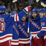 
              New York Rangers center Mika Zibanejad (93) celebrates his goal against the Tampa Bay Lightning with right wing Kaapo Kakko (24) and left wing Chris Kreider (20) during the first period of an NHL hockey game Thursday, Dec. 29, 2022, in Tampa, Fla. (AP Photo/Chris O'Meara)
            