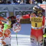 
              Switzerland's Wendy Holdener, winner of an an alpine ski, women's World Cup slalom, right, congratulates third-placed Slovakia's Petra Vlhova, in Sestriere, Italy, Sunday, Dec.11, 2022. (AP Photo/Alessandro Trovati)
            