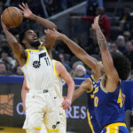 
              Utah Jazz guard Mike Conley (11) shoots against Golden State Warriors forward Anthony Lamb during the second half of an NBA basketball game in San Francisco, Wednesday, Dec. 28, 2022. (AP Photo/Jeff Chiu)
            