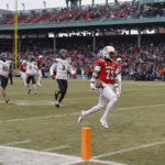 
              Louisville's Jawhar Jordan, right, runs past Cincinnati's Ja'von Hicks (3) for a touchdown during the first quarter of the Fenway Bowl NCAA college football game at Fenway Park Saturday, Dec. 17, 2022, in Boston. (AP Photo/Winslow Townson)
            