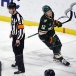 
              Minnesota Wild left wing Matt Boldy (12) celebrates after scoring the winning goal against the Anaheim Ducks as he skates past referee Mitch Dunning during a shootout in an NHL hockey game Saturday, Dec. 3, 2022, in St. Paul, Minn. (AP Photo/Craig Lassig)
            