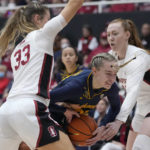 
              California guard Mia Mastrov, center, tries to get past Stanford guard Hannah Jump, left, and forward Ashten Prechtel, right, during the first half of an NCAA college basketball game in Stanford, Calif., Friday, Dec. 23, 2022. (AP Photo/Godofredo A. Vásquez)
            