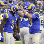 
              Los Angeles Rams running back Cam Akers (3) is congratulated by quarterback John Wolford (13) after scoring during the first half of an NFL football game against the Seattle Seahawks Sunday, Dec. 4, 2022, in Inglewood, Calif. (AP Photo/Marcio Jose Sanchez)
            