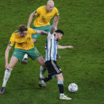 
              Argentina's Lionel Messi, right, tussles for the ball with Australia's Harry Souttar during the World Cup round of 16 soccer match between Argentina and Australia at the Ahmad Bin Ali Stadium in Doha, Qatar, Saturday, Dec. 3, 2022. (AP Photo/Manu Fernandez)
            