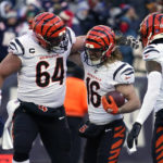 
              Cincinnati Bengals wide receiver Trenton Irwin (16) celebrates his touchdown with center Ted Karras (64) and wide receiver Tee Higgins (85) during the first half of an NFL football game against the New England Patriots, Saturday, Dec. 24, 2022, in Foxborough, Mass. (AP Photo/Charles Krupa)
            