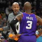 
              Phoenix Suns head coach Monty Williams, left, talks to guard Chris Paul (3) during the first half of an NBA basketball game against the Los Angeles Lakers, Monday, Dec. 19, 2022, in Phoenix. (AP Photo/Rick Scuteri)
            