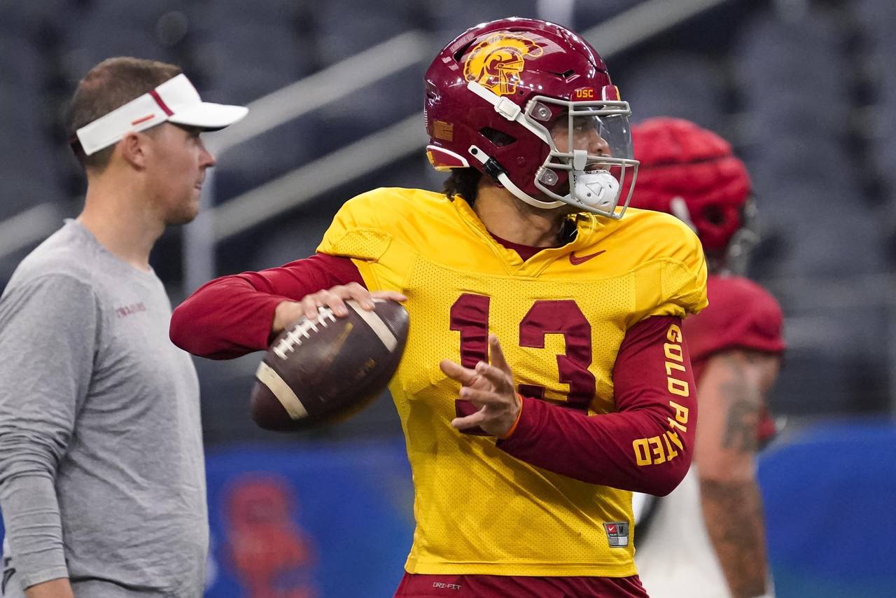 Southern California quarterback Caleb Williams (13) practices ahead of the Cotton Bowl NCAA college...