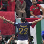 
              France's Theo Hernandez celebrates after scoring his side's first goal during the World Cup semifinal soccer match between France and Morocco at the Al Bayt Stadium in Al Khor, Qatar, Wednesday, Dec. 14, 2022. (AP Photo/Francisco Seco)
            