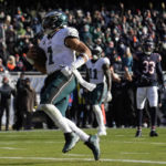 
              Philadelphia Eagles' Jalen Hurts runs for a touchdown during the first half of an NFL football game against the Chicago Bears, Sunday, Dec. 18, 2022, in Chicago. (AP Photo/Nam Y. Huh)
            