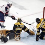 
              Boston Bruins' Jeremy Swayman (1) blocks a shot by Columbus Blue Jackets' Eric Robinson (50) during the second period of an NHL hockey game, Saturday, Dec. 17, 2022, in Boston. (AP Photo/Michael Dwyer)
            
