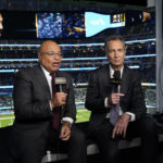 
              NBC Sports play-by-play announcer Mike Tirico, left, sits next to color commentator Cris Collinsworth before an NFL football game between the Los Angeles Chargers and the Miami Dolphins on Dec. 11, 2022, in Inglewood, Calif. (AP Photo/Jae C. Hong)
            
