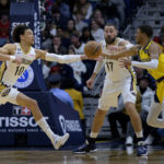
              New Orleans Pelicans center Jaxson Hayes (10) and Indiana Pacers guard Tyrese Haliburton, right, battle for the ball next to Pelicans center Jonas Valanciunas (17) in the first half of an NBA basketball game in New Orleans, Monday, Dec. 26, 2022. (AP Photo/Matthew Hinton)
            