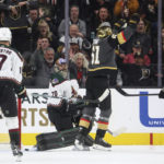 
              Vegas Golden Knights right wing Mark Stone (61) celebrates after scoring against Arizona Coyotes goaltender Karel Vejmelka (70) during the third period of an NHL hockey game Wednesday, Dec. 21, 2022, in Las Vegas. (AP Photo/Chase Stevens)
            