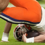 
              Clemson quarterback Cade Klubnik (2) takes a tumble as he is sacked by Tennessee linebacker Aaron Beasley during the first half of the Orange Bowl NCAA college football game, Friday, Dec. 30, 2022, in Miami Gardens, Fla. (AP Photo/Rebecca Blackwell)
            