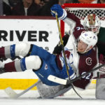 
              Colorado Avalanche left wing Artturi Lehkonen (62) collides with Arizona Coyotes goaltender Connor Ingram (39) during the third period of an NHL hockey game in Tempe, Ariz., Tuesday, Dec. 27, 2022. The Coyotes won 6-3. (AP Photo/Ross D. Franklin)
            