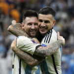
              Argentina's Lionel Messi and Leandro Paredes, right, celebrate at the end of the World Cup quarterfinal soccer match between the Netherlands and Argentina, at the Lusail Stadium in Lusail, Qatar, Saturday, Dec. 10, 2022. Argentina defeated the Netherlands 4-3 in a penalty shootout after the match ended tied 2-2. (AP Photo/Ricardo Mazalan)
            