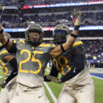 
              Army players celebrate after the team blocked a punt return by Navy for a touchdown in the second quarter of an NCAA college football game in Philadelphia, Saturday, Dec. 10, 2022. (Heather Khalifa/The Philadelphia Inquirer via AP)
            