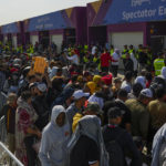 
              FILE - Fans queue outside of the Al Janoub Stadium in Wakrah, Qatar on Tuesday, Dec. 13, 2022 in the hope of getting tickets for Wednesday's World Cup semifinal soccer match between France and Morocco. (AP Photo/Francisco Seco, File)
            