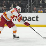 
              Calgary Flames center Jonathan Huberdeau (10) shoots and scores during the first period of an NHL hockey game against the Los Angeles Kings Thursday, Dec. 22, 2022, in Los Angeles. (AP Photo/Ashley Landis)
            