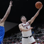 
              Stanford guard Michael O'Connell (5) shoots next to UCLA forward Mac Etienne (12) during the first half of an NCAA college basketball game in Stanford, Calif., Thursday, Dec. 1, 2022. (AP Photo/Godofredo A. Vásquez)
            