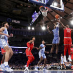 
              North Carolina forward Leaky Black (1) and Ohio State forward Brice Sensabaugh (10) fight for the ball during the second half of an NCAA college basketball game in the CBS Sports Classic, Saturday, Dec. 17, 2022, in New York. The Tar Heels won 89-84 in overtime. (AP Photo/Julia Nikhinson)
            