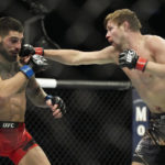 
              Bryce Mitchell hits Ilia Topuria during a UFC 282 mixed martial arts featherweight bout Saturday, Dec. 10, 2022, in Las Vegas. (AP Photo/John Locher)
            
