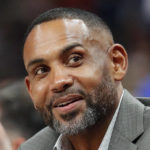 
              FILE - Atlanta Hawks vice chairman Grant Hill sits court side during the first half of an NBA basketball game against the Dallas Mavericks on Wednesday, Oct. 24, 2018, in Atlanta. Let the recruiting begin. The braintrust for the U.S. — managing director Grant Hill, national team director Sean Ford and coach Steve Kerr — is already well into the process of trying to get players thinking about wearing the red, white and blue at the World Cup in 2023 as well as the Paris Olympics in 2024. (AP Photo/John Bazemore, File)
            