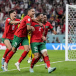
              Morocco's players celebrate their victory over Spain during the World Cup round of 16 soccer match between Morocco and Spain, at the Education City Stadium in Al Rayyan, Qatar, Tuesday, Dec. 6, 2022. (AP Photo/Martin Meissner)
            