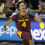 
              Arizona State guard Desmond Cambridge Jr. celebrates after hitting the winning 3-point basket against Colorado in the second half of an NCAA college basketball game Thursday, Dec. 1, 2022, in Boulder, Colo. (AP Photo/David Zalubowski)
            