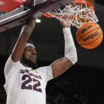 
              Arizona State forward Warren Washington dunks against Stanford during the second half of an NCAA college basketball game in Tempe, Ariz, Sunday, Dec. 4, 2022. (AP Photo/Ross D. Franklin)
            