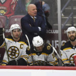 
              Boston Bruins' coach Jim Montgomery watches his team play the Florida Panthers during the first period of an NHL hockey game, Wednesday, Nov. 23, 2022, in Sunrise, Fla. (AP Photo/Michael Laughlin)
            