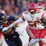 
              Kansas City Chiefs linebacker Willie Gay, right, runs past Denver Broncos quarterback Russell Wilson (3) to score a touchdown after intercepting a Wilson pass during the first half of an NFL football game Sunday, Dec. 11, 2022, in Denver. (AP Photo/David Zalubowski)
            