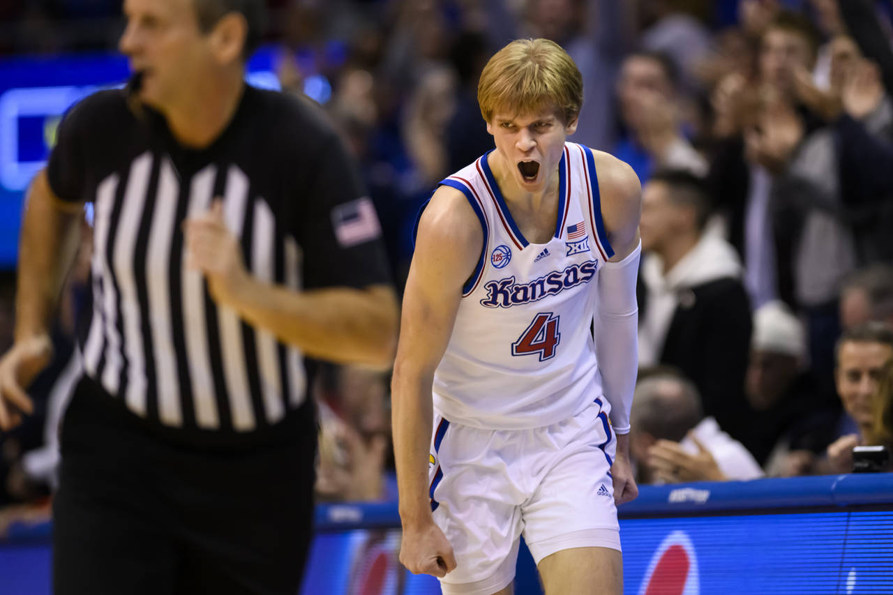 Kansas guard Gradey Dick celebrates a basket against Indiana during the second half of an NCAA coll...