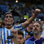 
              A fan wears a mask of Argentinean soccer star Diego Maradona prior to the World Cup semifinal soccer match between Argentina and Croatia at the Lusail Stadium in Lusail, Qatar, Tuesday, Dec. 13, 2022. (AP Photo/Natacha Pisarenko)
            