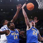 
              UCLA guard Jaime Jaquez Jr. (24) shoots during the first half of an NCAA college basketball game against Kentucky in the CBS Sports Classic, Saturday, Dec. 17, 2022, in New York. (AP Photo/Julia Nikhinson)
            