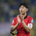 
              South Korea's Son Heung-min applauds the fans after losing 4-1 during the World Cup round of 16 soccer match between Brazil and South Korea at the Stadium 974 in Doha, Qatar, Monday, Dec. 5, 2022. (AP Photo/Jin-Man Lee)
            
