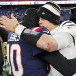 
              New England Patriots quarterback Mac Jones, left, hugs Cincinnati Bengals quarterback Joe Burrow, right, following an NFL football game, Saturday, Dec. 24, 2022, in Foxborough, Mass. (AP Photo/Charles Krupa)
            