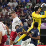 
              France's goalkeeper Hugo Lloris blocks a shot during a World Cup group D soccer match against Denmark at the Stadium 974 in Doha, Qatar, Saturday, Nov. 26, 2022. (AP Photo/Martin Meissner)
            
