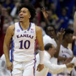 
              Kansas forward Jalen Wilson (10) celebrates after making a basket during the second half of an NCAA college basketball game against Oklahoma State Saturday, Dec. 31, 2022, in Lawrence, Kan. Kansas won 69-67. (AP Photo/Charlie Riedel)
            