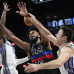 
              Detroit Pistons forward Marvin Bagley III (35) is fouled by Sacramento Kings guard Matthew Dellavedova (8) in the first half of an NBA basketball game in Detroit, Friday, Dec. 16, 2022. (AP Photo/Paul Sancya)
            