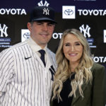 
              New York Yankees' Carlos Rodon poases for a photo with his wife Ashley during his introductory baseball news conference at Yankee Stadium, Thursday, Dec. 22, 2022, in New York. (AP Photo/Adam Hunger)
            